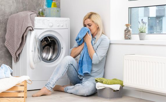 pretty smiling girl in the laundry room