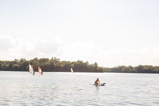 A beautiful woman practicing paddle on a beautiful sunny day