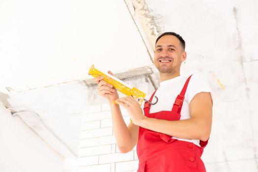 Young man fixing ceiling insulated. Renovation, construction