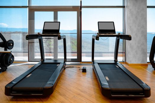 Studio shot of a professional treadmill in a modern gym