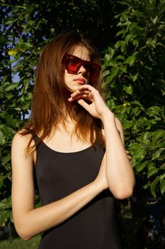 pretty woman wearing sunglasses summer nature posing. High quality photo