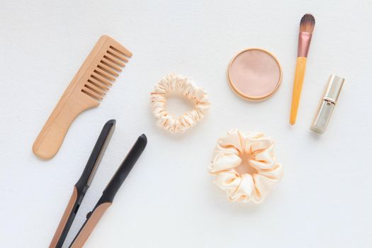 wooden Hairbrush, hair straightener and silk yellow Scrunchy isolated on white. Flat lay Hairdressing tools and accessoriesas Color Hair Scrunchies, Elastic Hair Bands, Bobble Sports Scrunchie Hairband