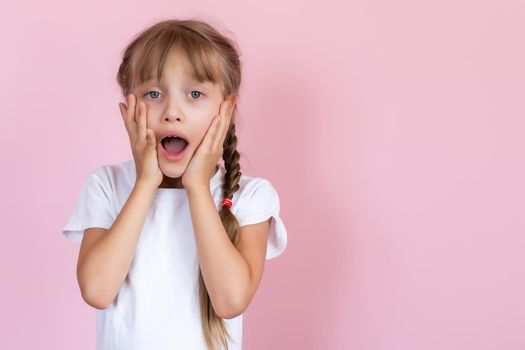 Cute Little Girl Covering Her Mouth Showing Intense Expression of Fear and Terror, Isolated