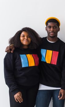 Happy African American woman and man have relationships, toothy smile, happy to meet with friends, dressed casually on white background. Emotions and friendship