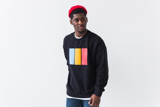 Young handsome african american man with an afro hairstyle. Portrait on white background. Guy looking at camera