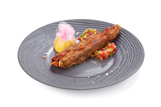 Fried fish on plate isolated on white background