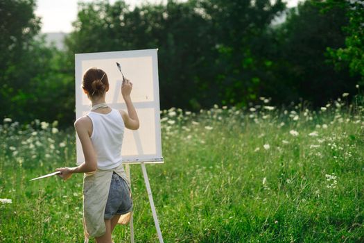 woman artist nature drawing art creative picnic. High quality photo