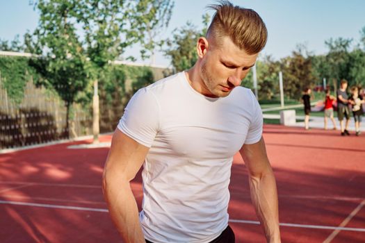 man doing exercises outdoors on the playground. High quality photo