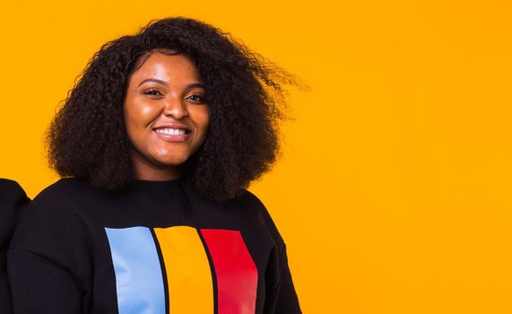 Young beautiful african american girl with an afro hairstyle. Portrait on white background