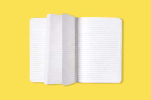 Blank open office Notepad or notebook with flipping pages isolated on yellow background. Mock up. Top view