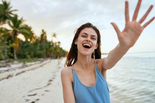 woman in blue swimsuit on the beach island lifestyle. High quality photo