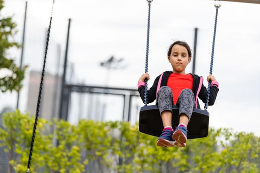 Little girl on a sports ground on the street leads a healthy lifestyle. In a healthy body healthy mind. Active lifestyle. Pretty young girl. Child for healthy lifestyle.