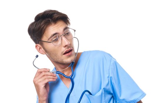 male doctor wearing glasses stethoscope posing light background. High quality photo