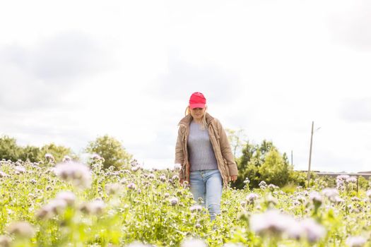 Portrait of beautiful girl in field