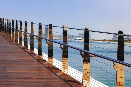 Pedestrian hanging bridge over sea in Dubai Marina, UAE