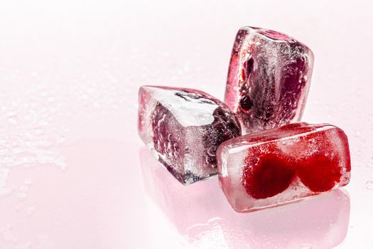 Close up of ice cubes with berries. Close up.