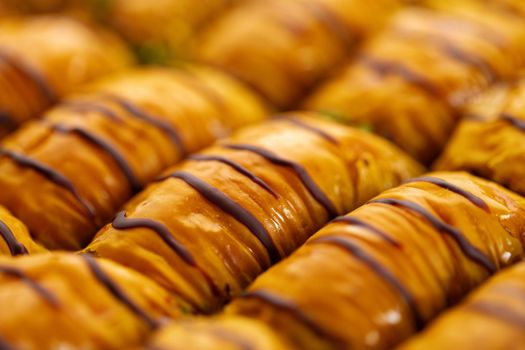 Turkish baklava dessert with honey, close up photo