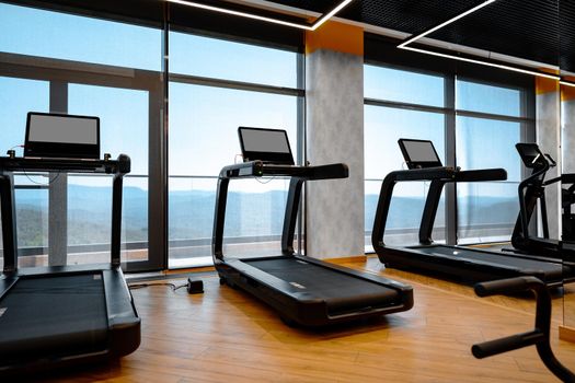 Studio shot of a professional treadmill in a modern gym