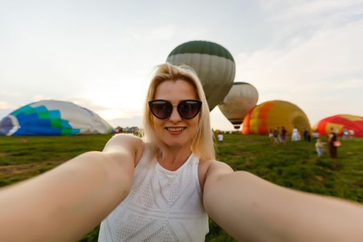 Amazing view with woman and air balloon. Artistic picture. Beauty world. The feeling of complete freedom