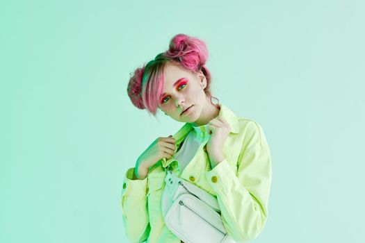 glamorous fashionable woman with pink hair posing hipster neon. High quality photo