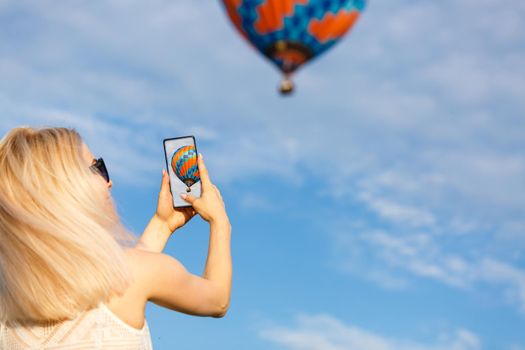 Amazing view with woman and air balloon. Artistic picture. Beauty world. The feeling of complete freedom