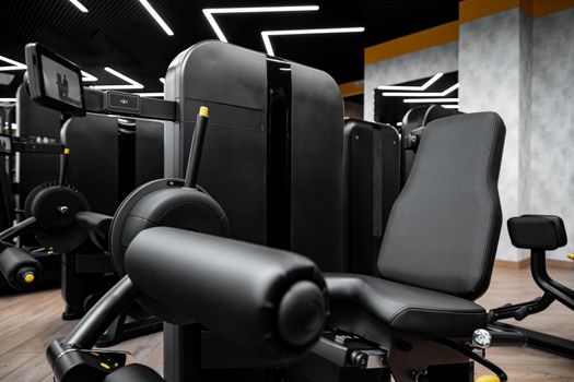 Modern gym interior with new fitness equipment, no people