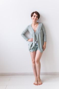 Portrait of a pretty smiling woman posing isolated on a white background