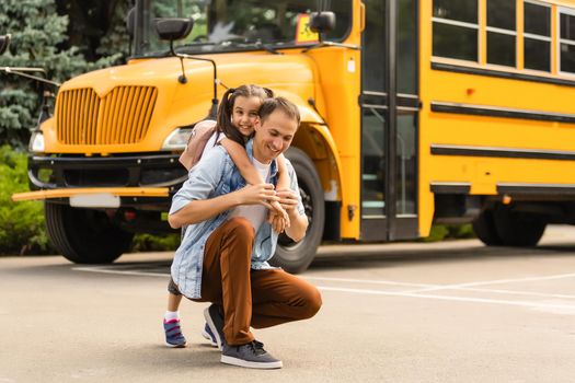 Happy day of back to school. Smiling father taking child to primary school.