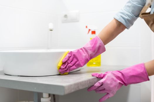 Clean up your house, woman cleaning the bathroom