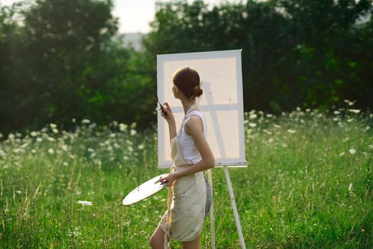 woman artist nature drawing art creative picnic. High quality photo