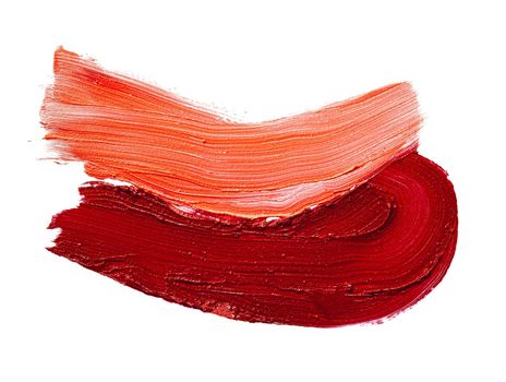 Smudged lipsticks lines isolated on white background close up