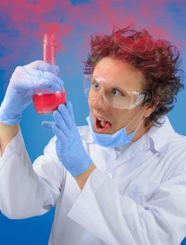 Crazy man scientist examines flask with red liquid