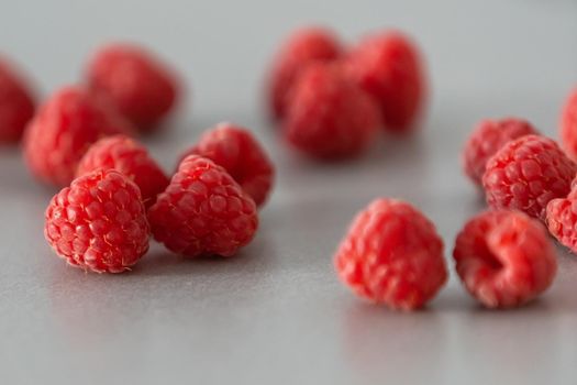 red Raspberry fruit on gray background chocolate