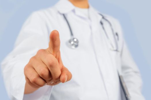 Unrecognizable man doctor is touching something in the air, copyspace