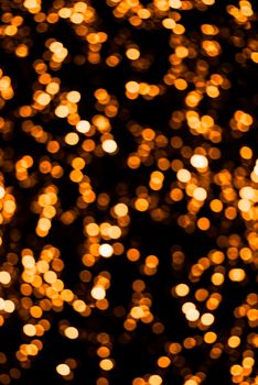Orange and gold Blurred lights background. Defocused glitter background. New year or Christmas background