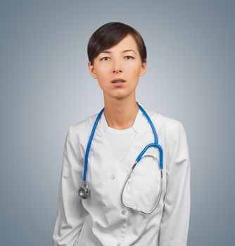 Woman doctor standing with a amazed expression