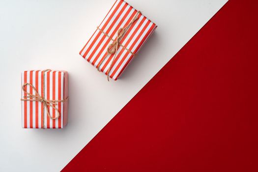 Beautiful red and white composition with Christmas gifts, view from above