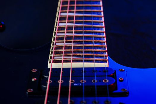 Electric guitar body in the dark close up shot