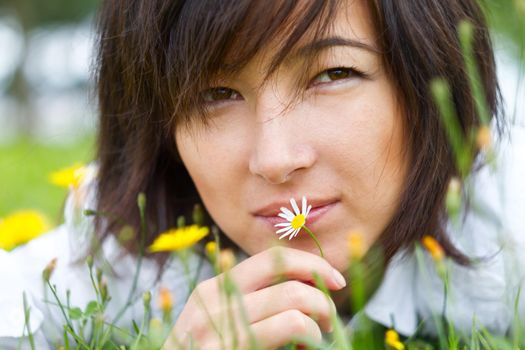 Portrait of a beautiful woman on nature, close-up