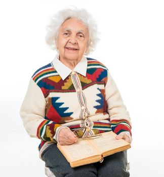 elderly woman flipping an old book isoalted on white background