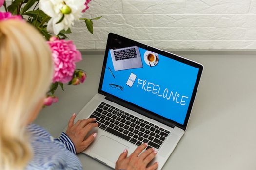 Unemployed young woman searching online for job