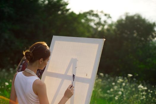 woman artist outdoors paint palette painting landscape. High quality photo