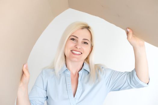 Pleasant woman opening cardboard box