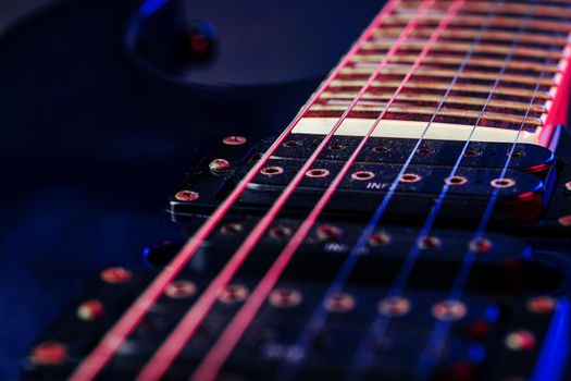 Electric guitar body in the dark close up shot