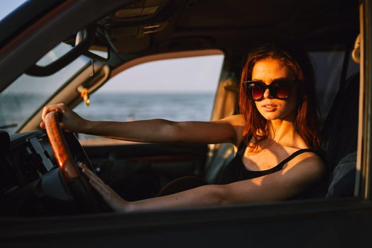 woman driving in car trip posing fashion travel. High quality photo