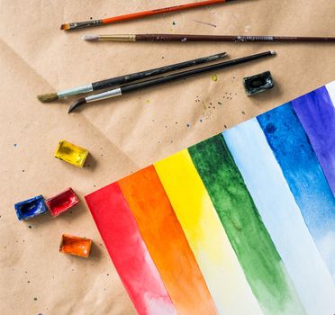 diverse set of watercolor brush strokes with painted brushes and boxes on working space