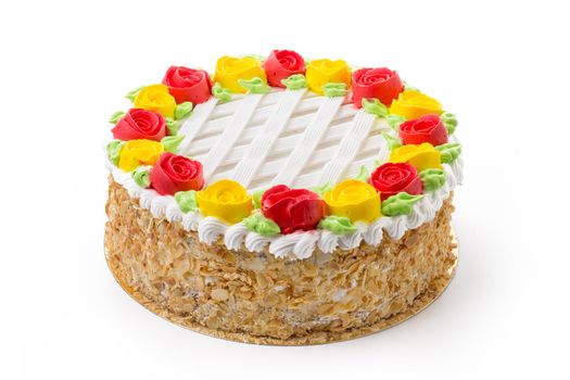 Decorated sponge cake isolated on white background close up