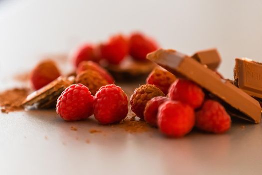 red Raspberry fruit on gray background chocolate