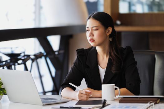 Company employees show boredom from unfinished work using computer notebook, documents and tablets at work