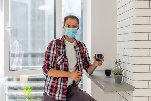man with face mask serving coffee through window, shop open after lockdown.